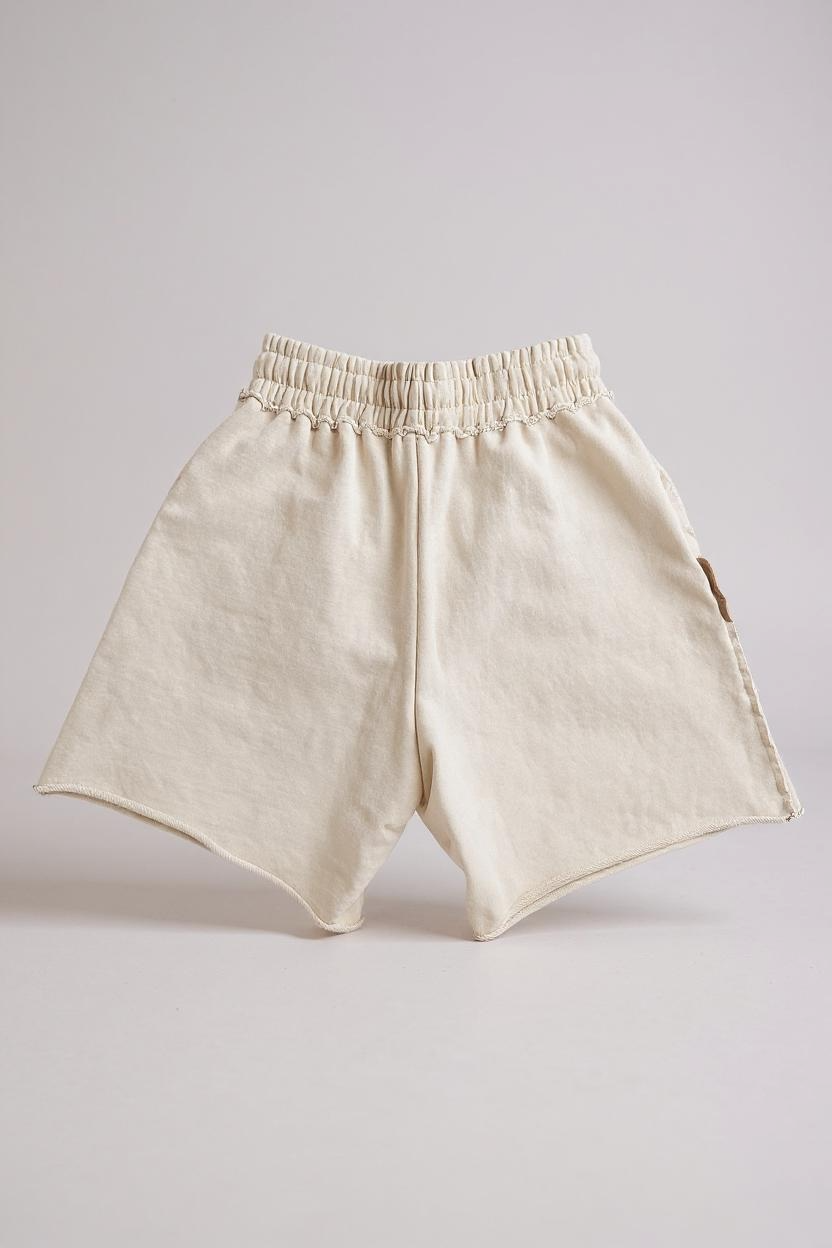 COMME DES FUCKDOWN - SHORTS CON ROTTURE E STAMPA